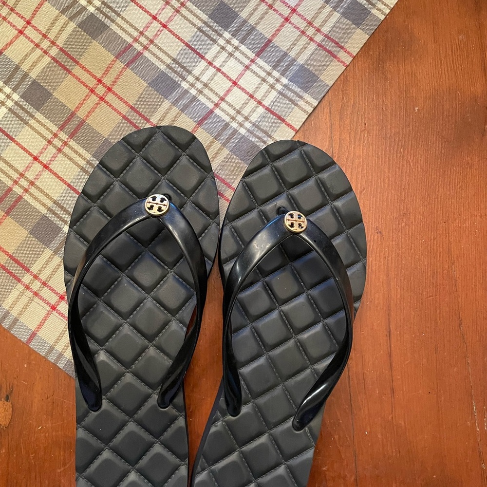 Tory Burch black platform flip flops.